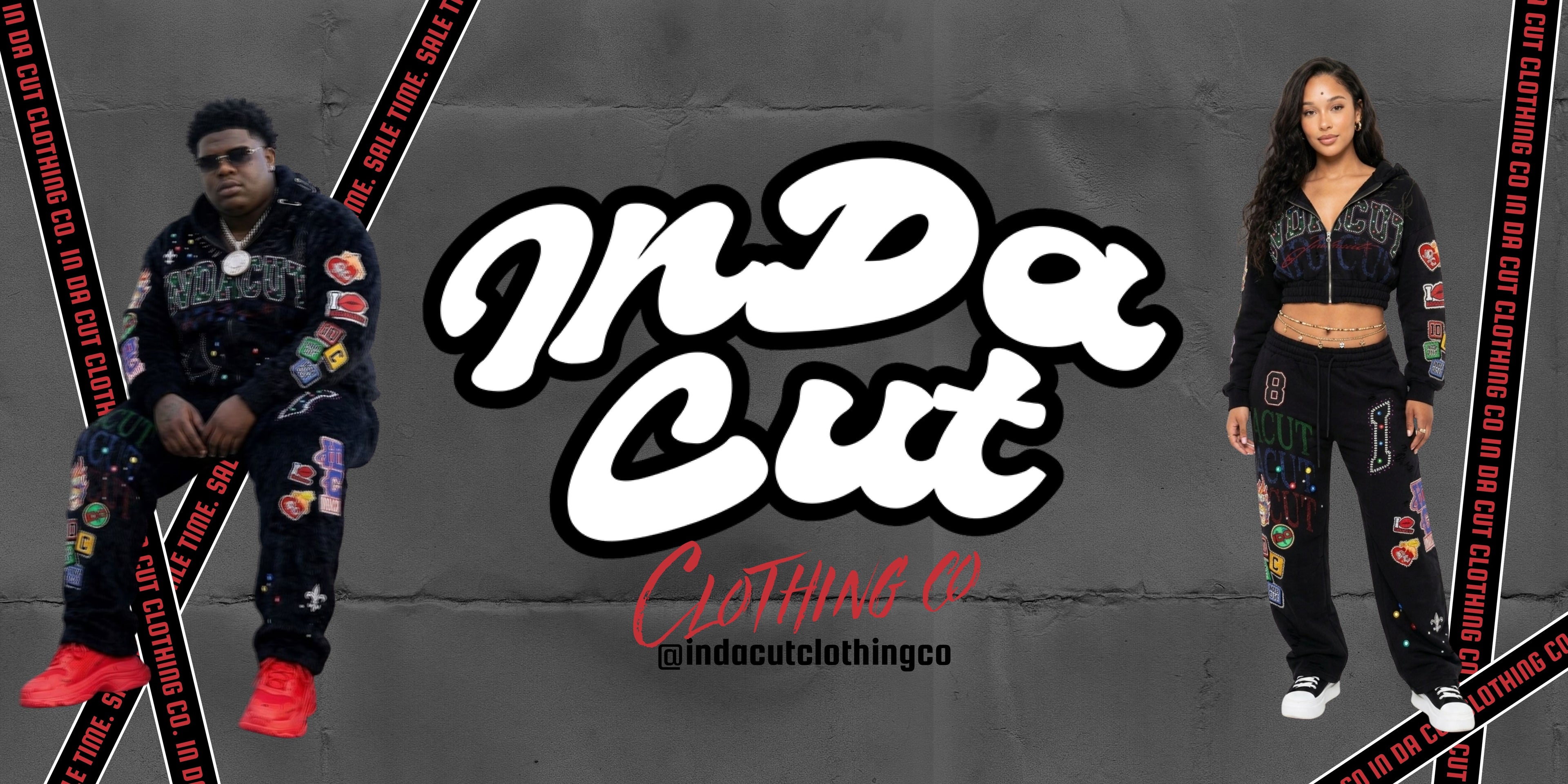 Two people modeling 'In Da Cut Clothing Co' urban streetwear outfits with brand logo and social media handle.